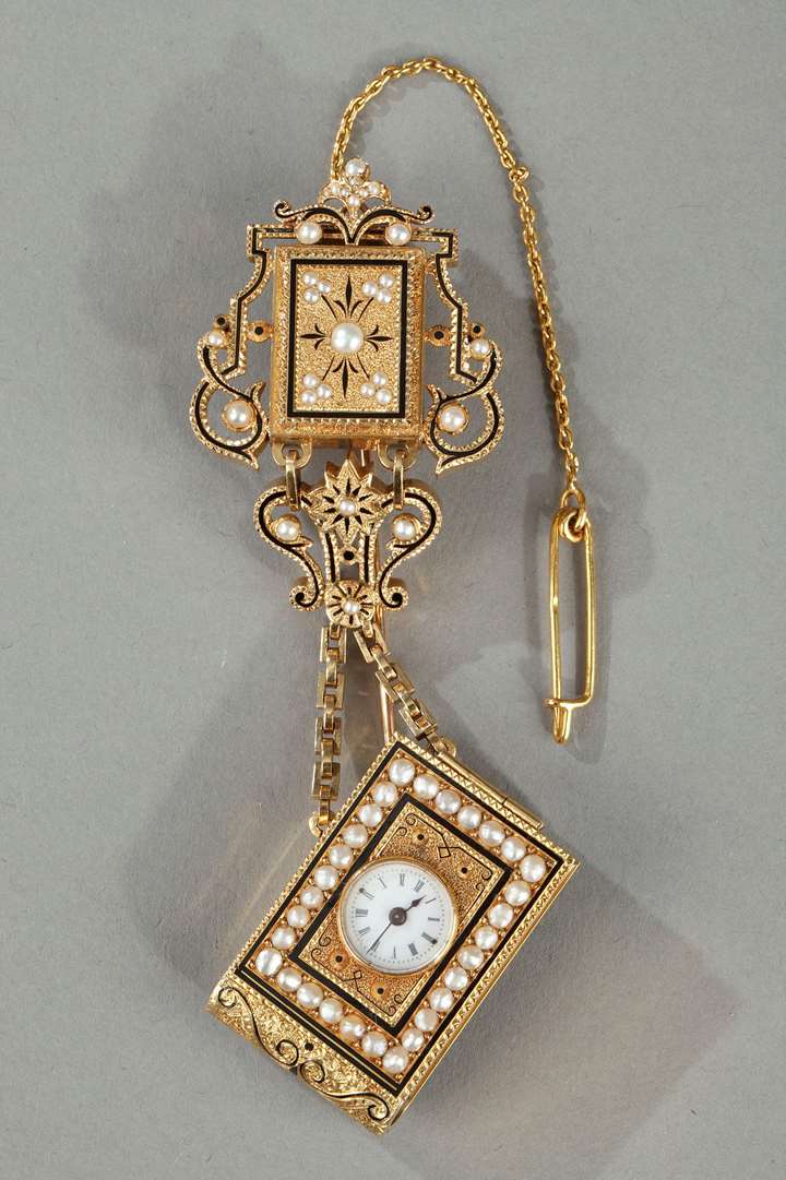 A gold and enamel watch with associated chatelaine.